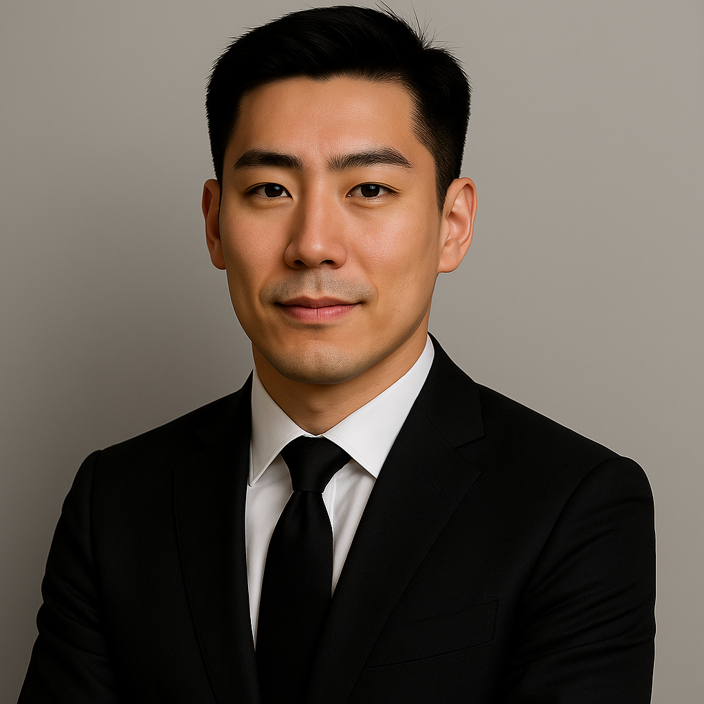 Black and white portrait of a dance instructor posing in front of a dark background.
