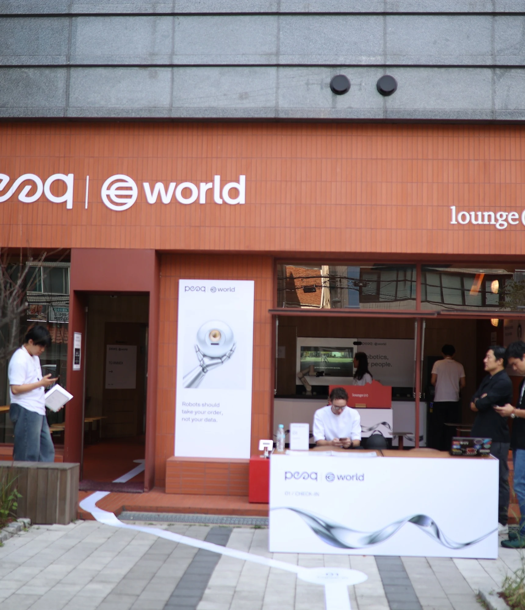World × peaq: Venue facade with peaq and World signs, KBW 2026